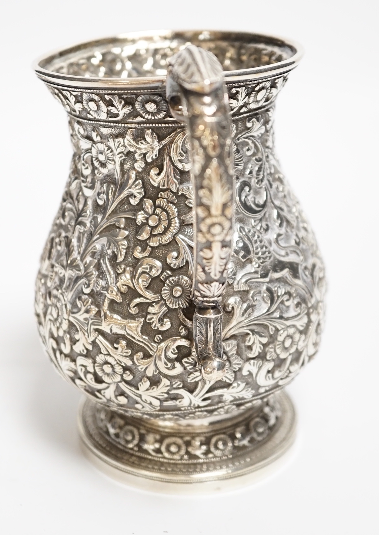 A George II silver waiter, Henry Morris, London, 1747, 17.6cm, together with an Indian? white metal baluster mug and a white metal small bowl.